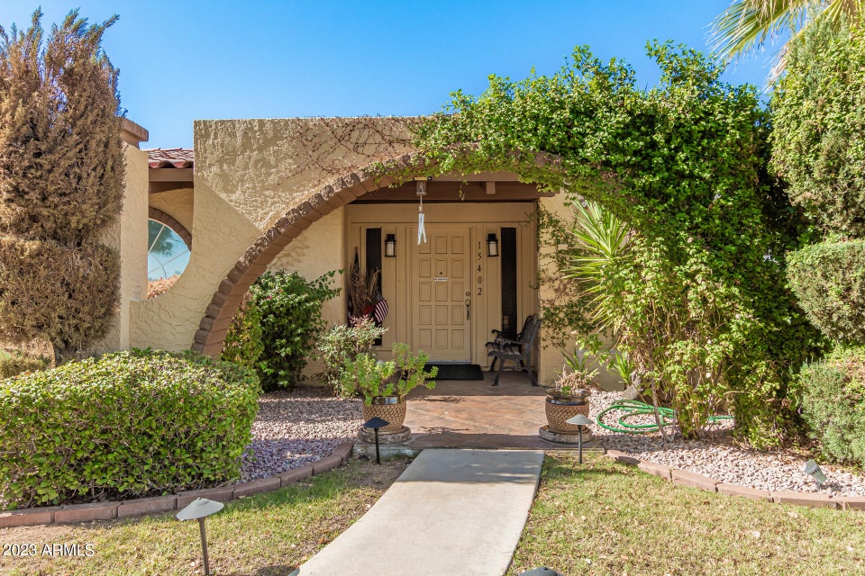 Arched front entry with double doors
