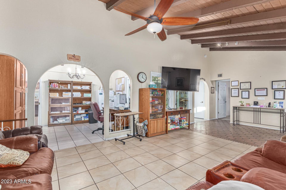 Great room with beamed ceiling and seating