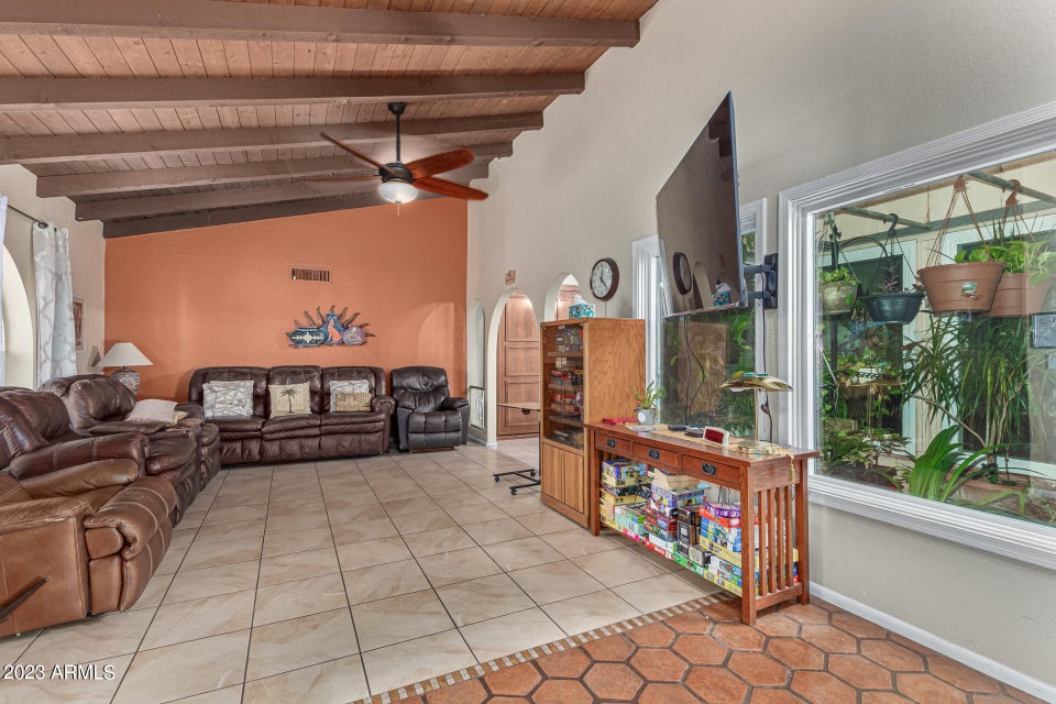 Living room with beamed ceiling